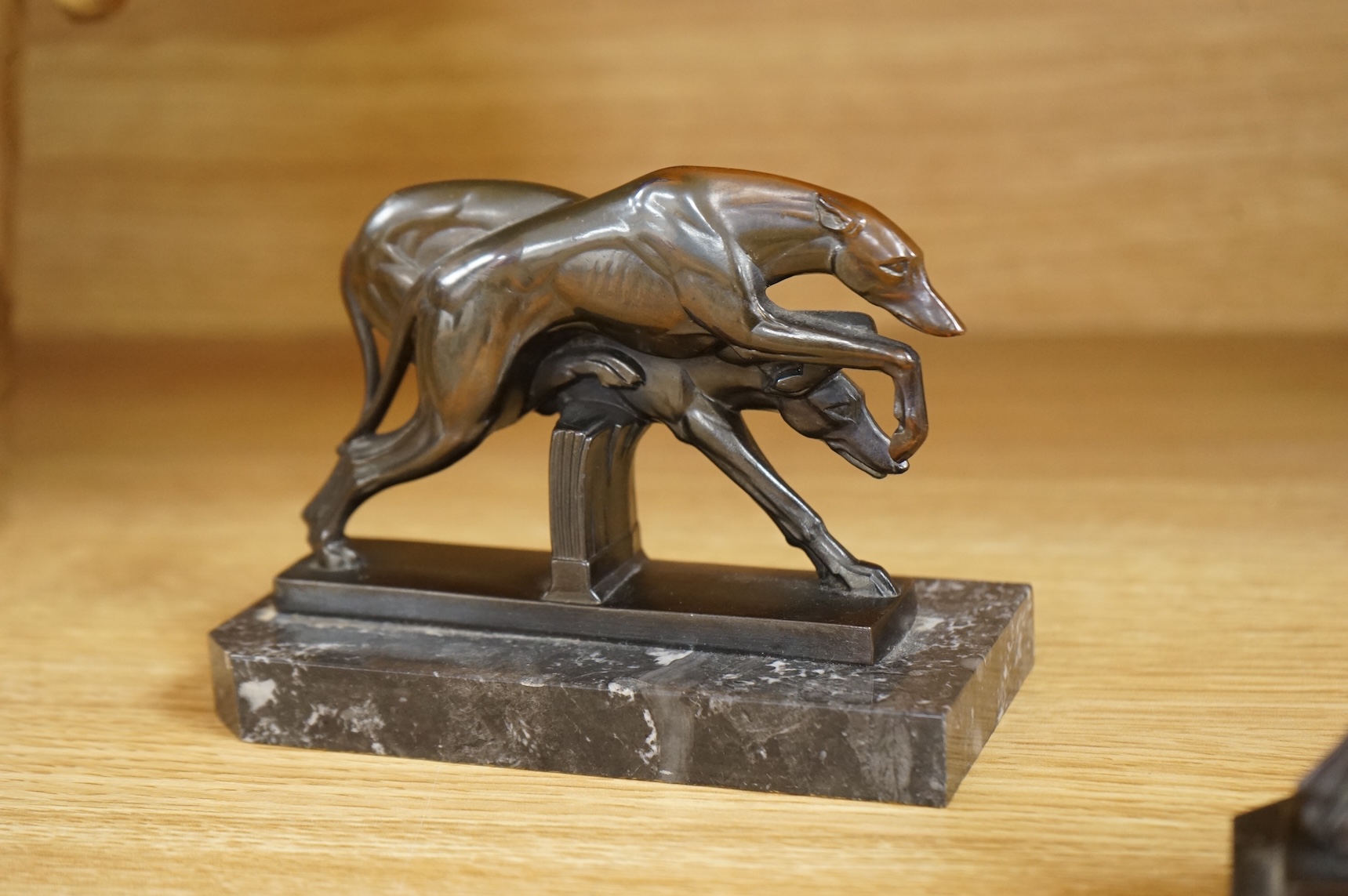 A pair of French Art Deco spelter bookends in the form of racing greyhounds, 14.5cm wide